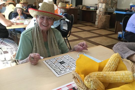 Older lady playing bingo and having fun